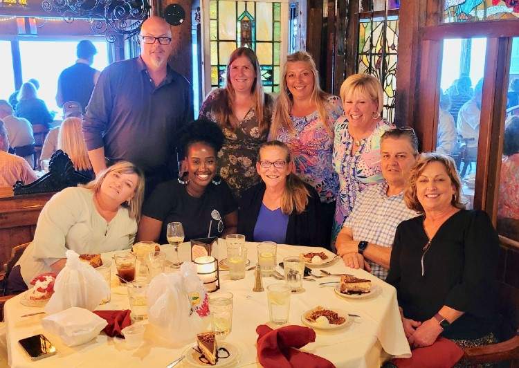 Team enjoying a meal at a restaurant