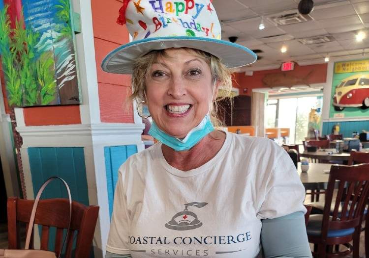 Team member in birthday hat